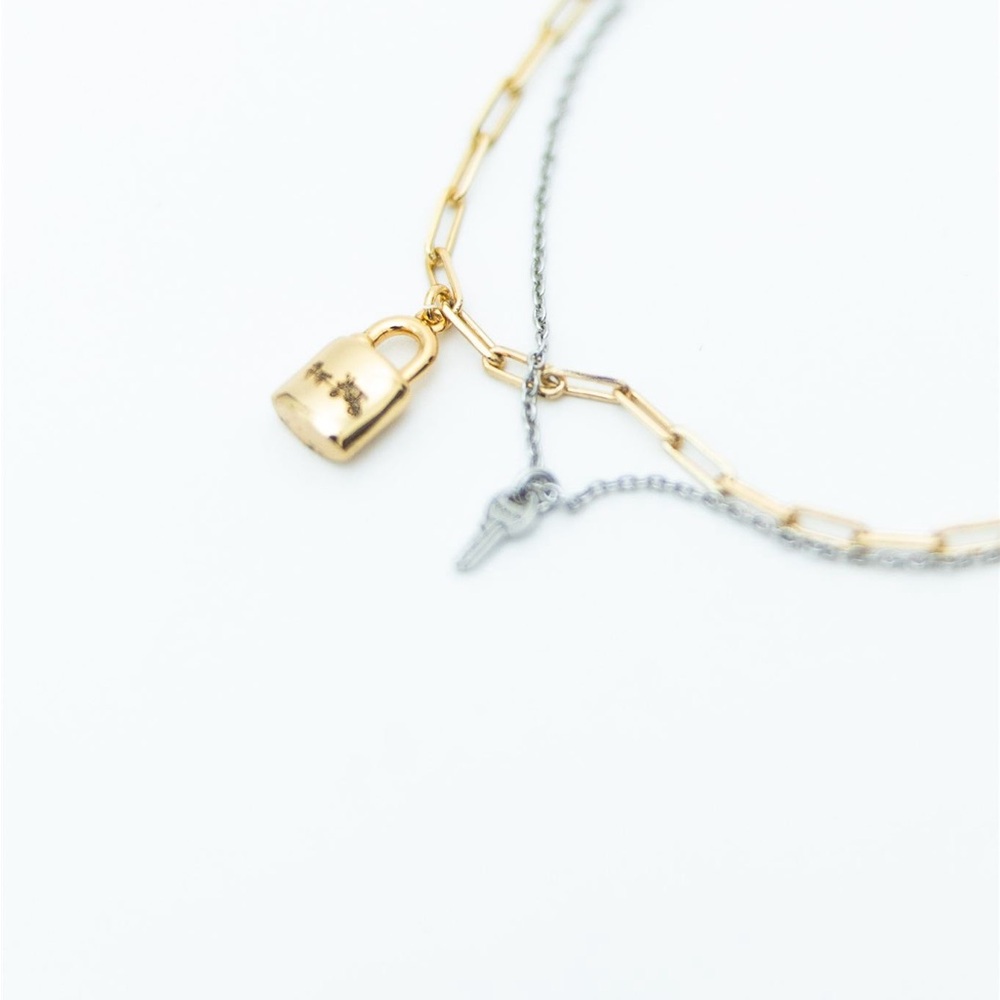 Coach Two-Tone Gold and Silver Bracelet with Lock and Key Charms - Picture 2 of 3
